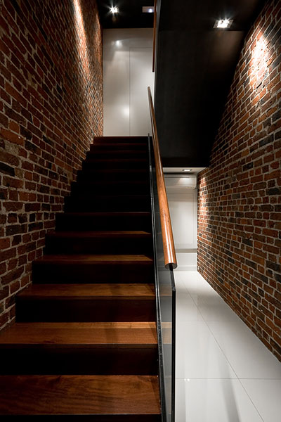 Brighton Implant Clinic - Main stairwell with existing brickwork walls