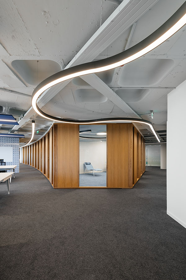 OLX Group Offices - View of main meeting room cluster with wooden partition walls