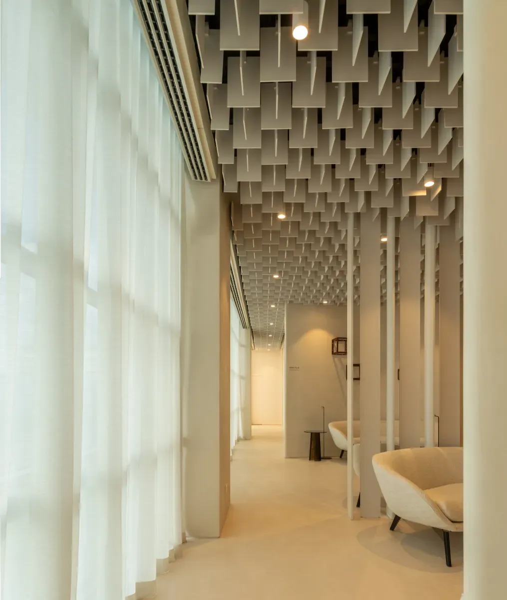 Waiting area along the window with sheer curtains