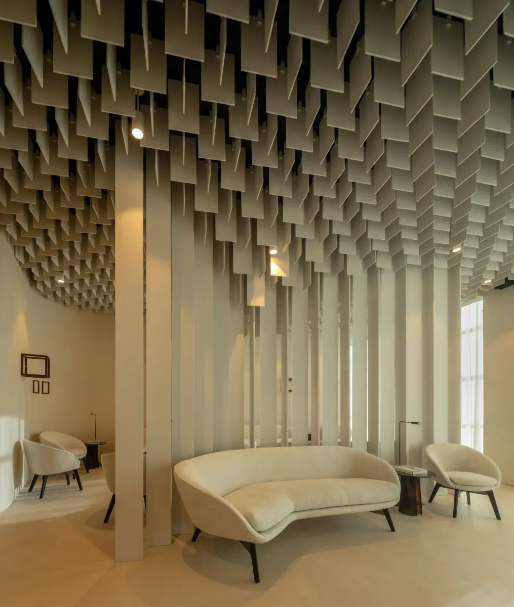 Waiting lounge framed by ceiling slats extending to the floor